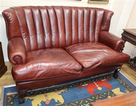 A Victorian design burgundy leather two seater settee W.170cm